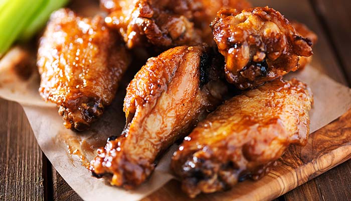 BBQ tossed buffalo chicken wings served at Big Cherry Brewing Company restaurant, brewery and bar located in Big Stone Gap, VA logo BBQ tossed buffalo chicken wings served at Big Cherry Brewing Company restaurant, brewery and bar located in Big Stone Gap, VA logo