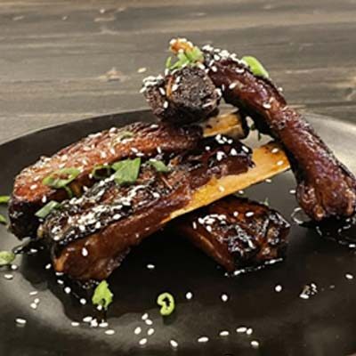 Asian inspired BBQ ribs served at Big Cherry Brewing Company restaurant, brewery and bar located in Big Stone Gap, VA logo
